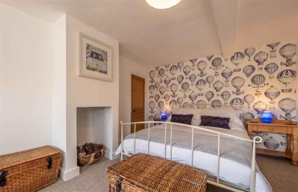 First floor: Master bedroom with double bed at Ember Cottage, Litcham near Kings Lynn