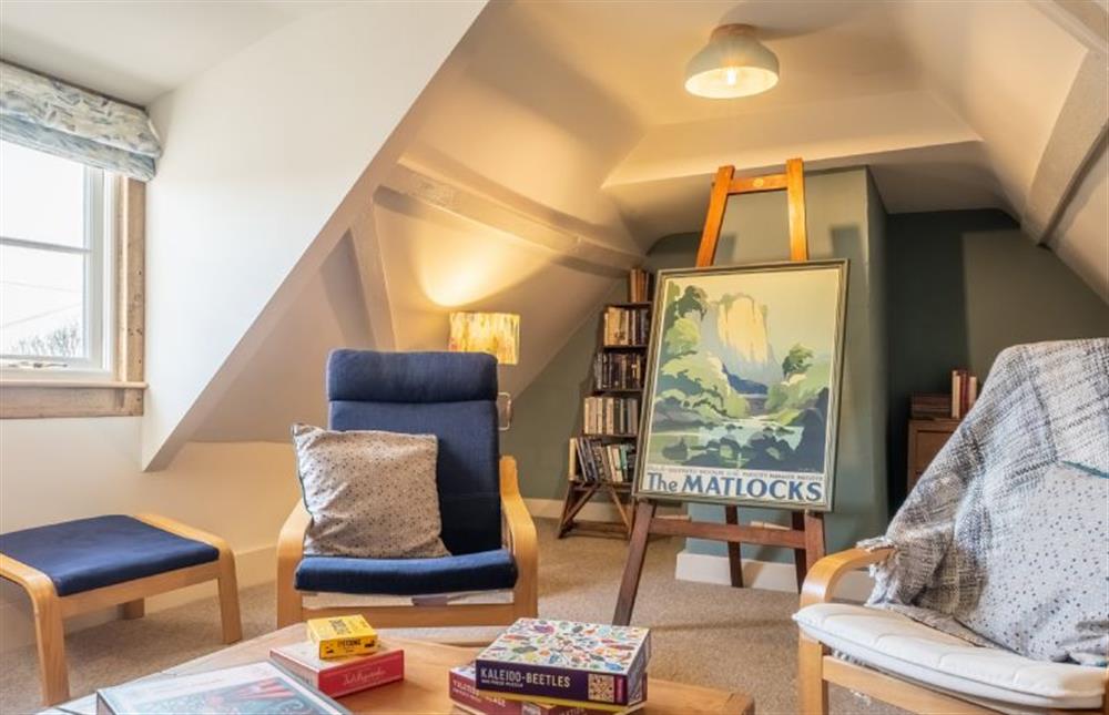 Second floor: Loft room with a selection of books and games