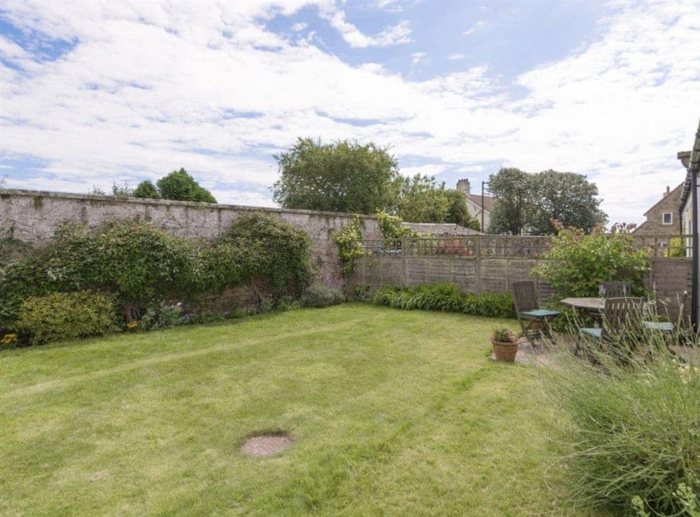 Enclosed lawned rear garden at Embleton Cottage in Beadnell, Northumberland