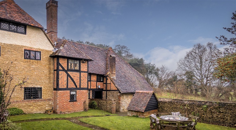 The exterior and outdoor furniture at Emley Farmhouse in Godalming, Surrey