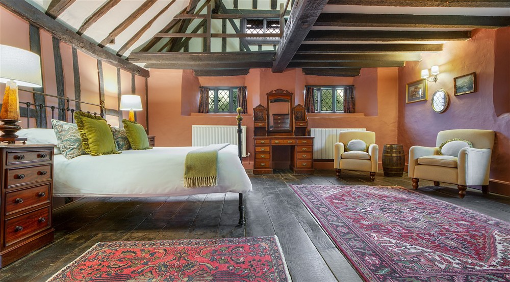 The main bedroom at Emley Farmhouse in Godalming, Surrey