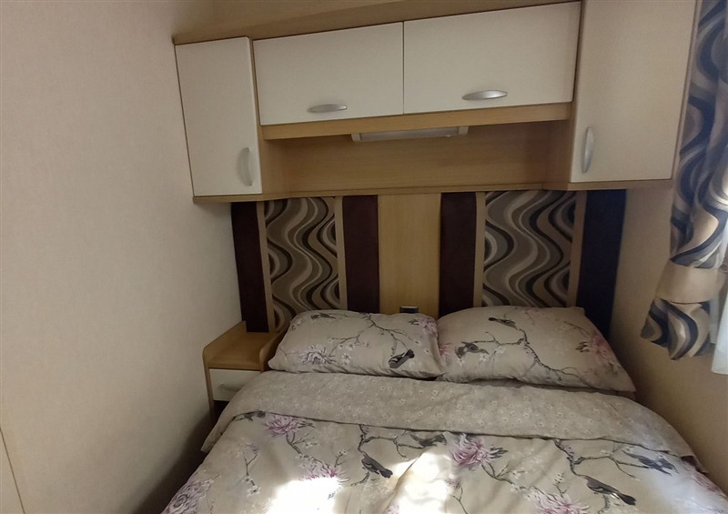 This is a bedroom (photo 3) at Emma 6, Llandegfan