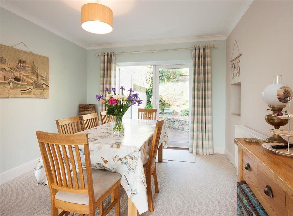 Elegant dining area with access to garden at End House in Coronation/Forster, Devon