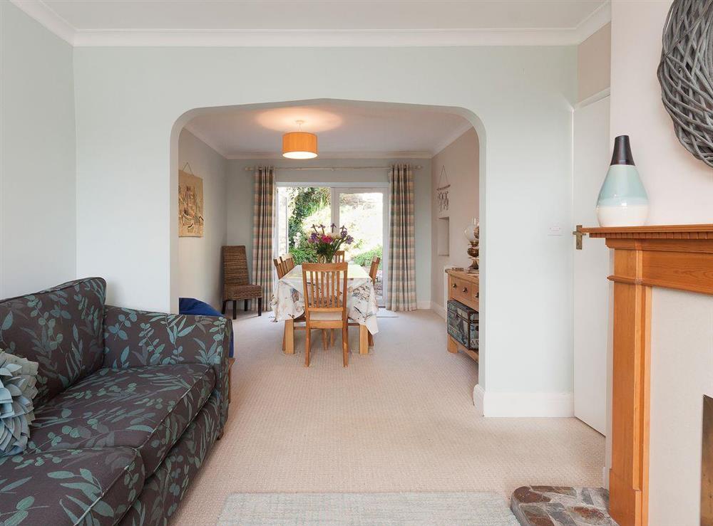 Living area with archway through to the dining room at End House in Coronation/Forster, Devon