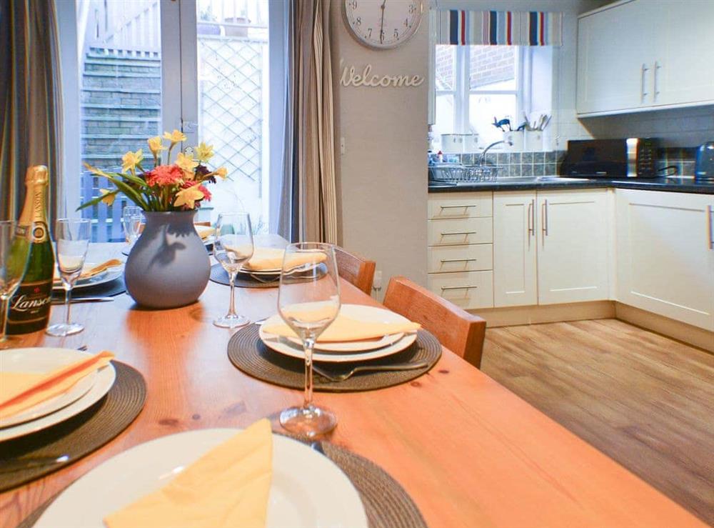 Dining and adjacent kitchen at Endeavour Cottage in Whitby, North Yorkshire