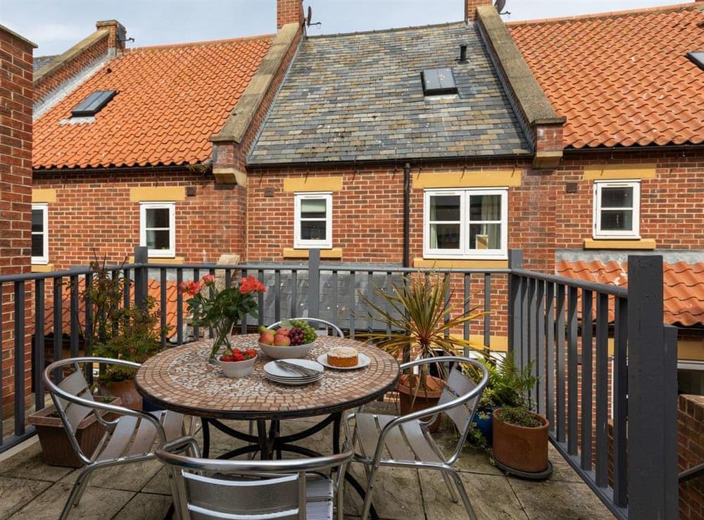 Patio area with outdoor furniture at Endeavour Cottage in Whitby, North Yorkshire