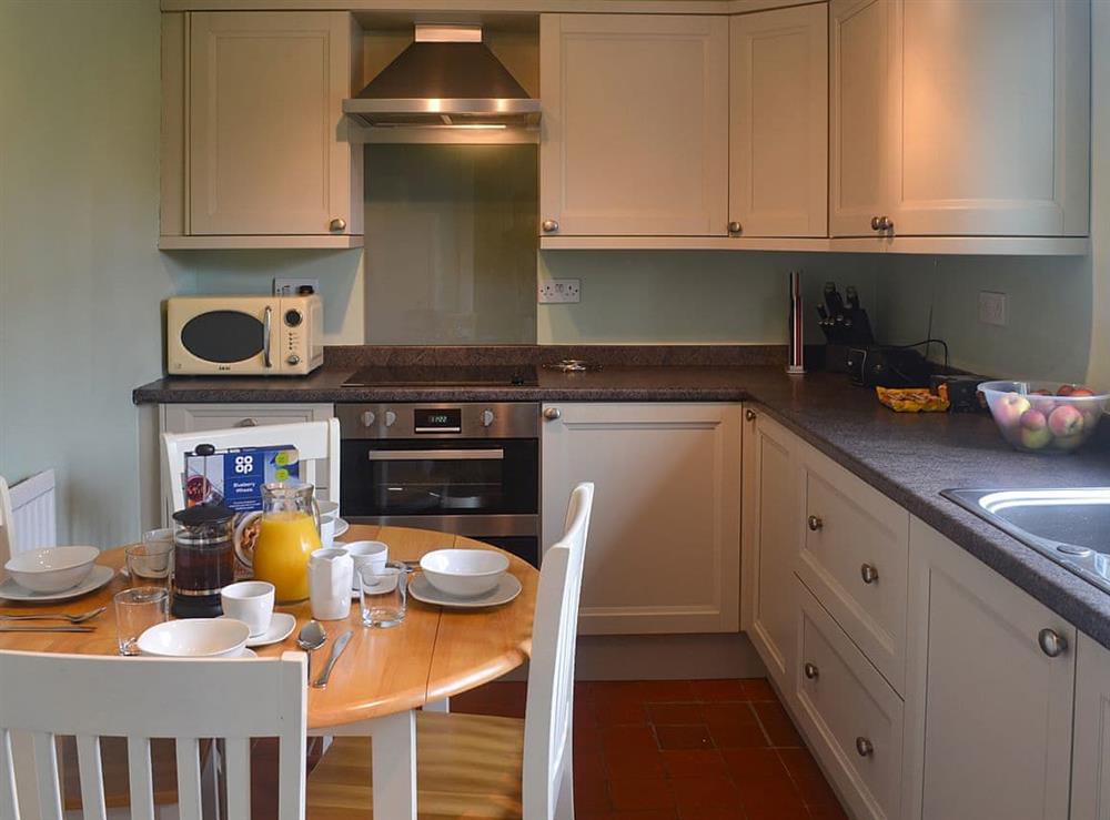 Kitchen with breakfast area at Enlli in Llanuwchllyn, near Bala, Gwynedd