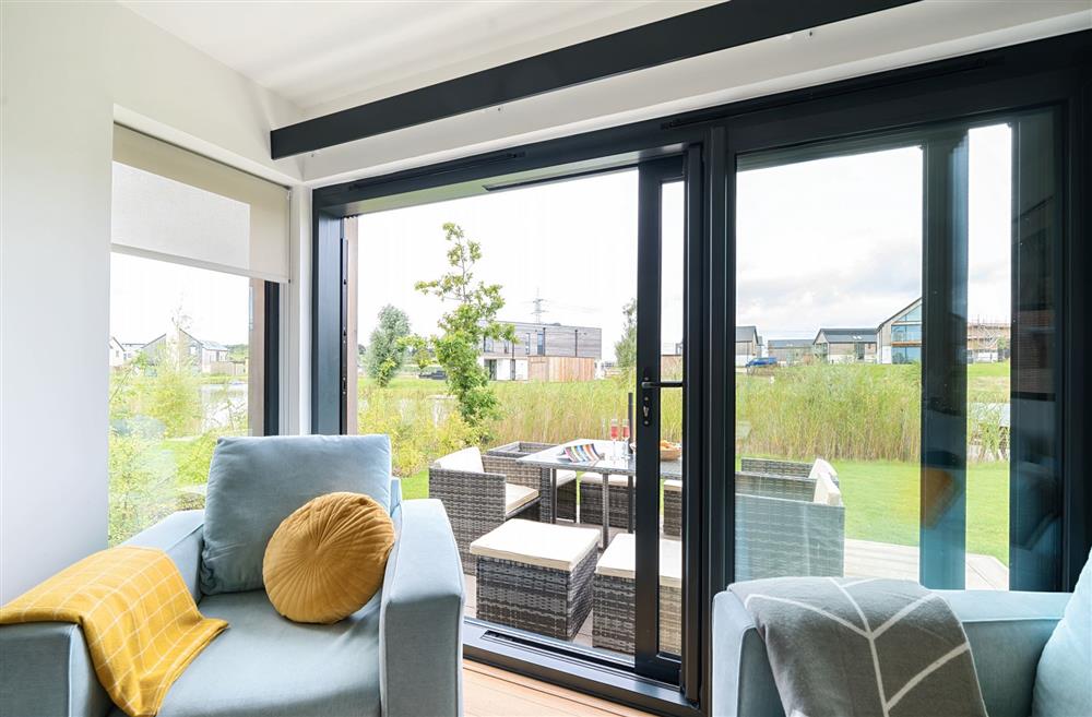 The sliding patio doors, with views of the lake at Equinox, Dorchester