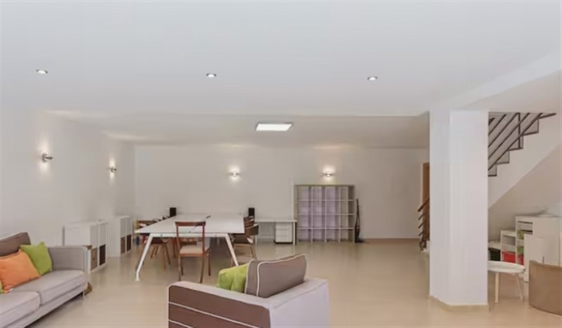 Relax in the living area at Equinox: Elegant house with a swimming pool, Cornwall