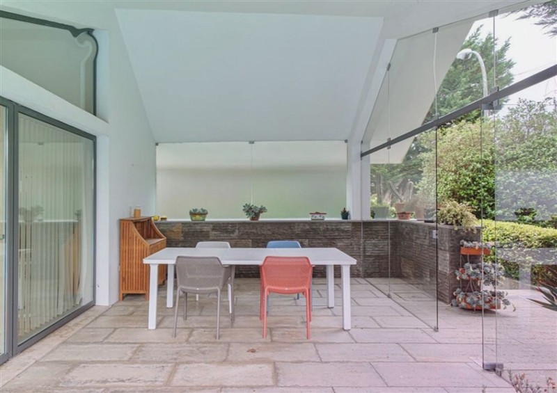 The patio at Equinox: Elegant house with a swimming pool, Cornwall