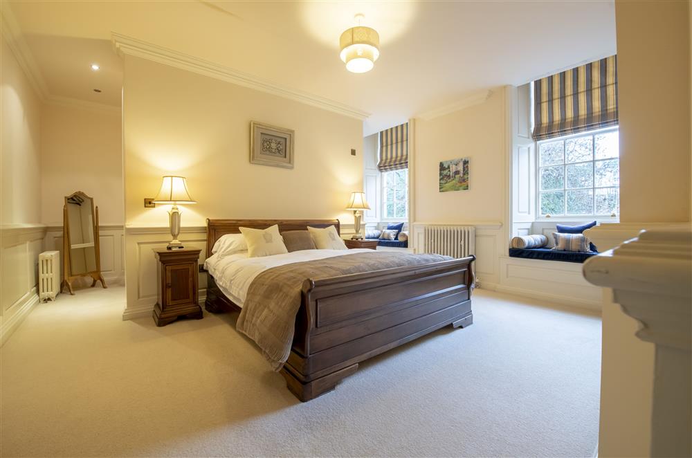 Bedroom one with a 6’ super-king size bed and en-suite at Eslington East Wing, Alnwick