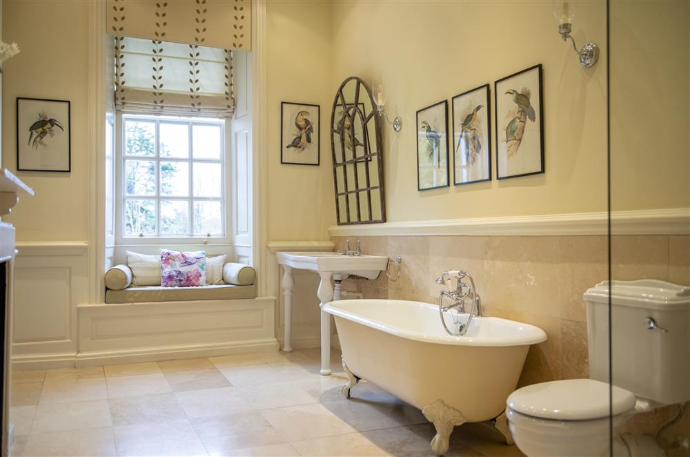En-suite bathroom with roll-top bath and walk-in shower at Eslington East Wing, Alnwick