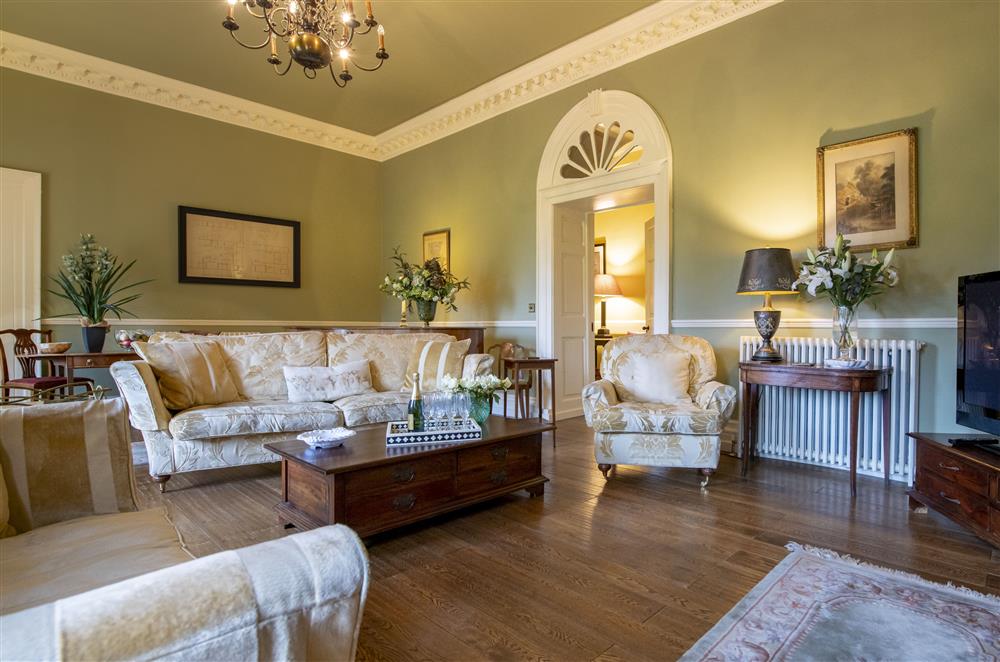 Enjoy the comfortable seating in the sitting room after a day of exploring at Eslington East Wing, Alnwick