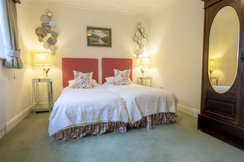 Bedroom four with twin 3’ single beds and en-suite bathroom at Eslington Lodge, Alnwick