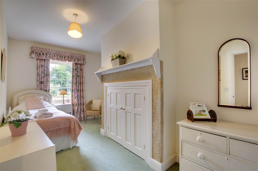 Bedroom two with a 3’ single bed,  storage and en-suite shower room at Eslington Lodge, Alnwick
