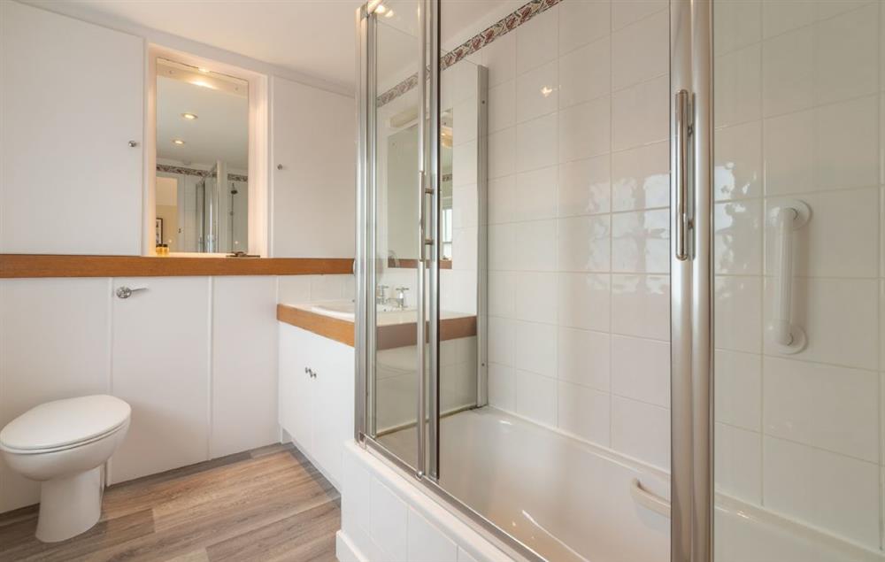 Master bedroom en-suite with power shower over the bath at Estcourt House, Burnham Market