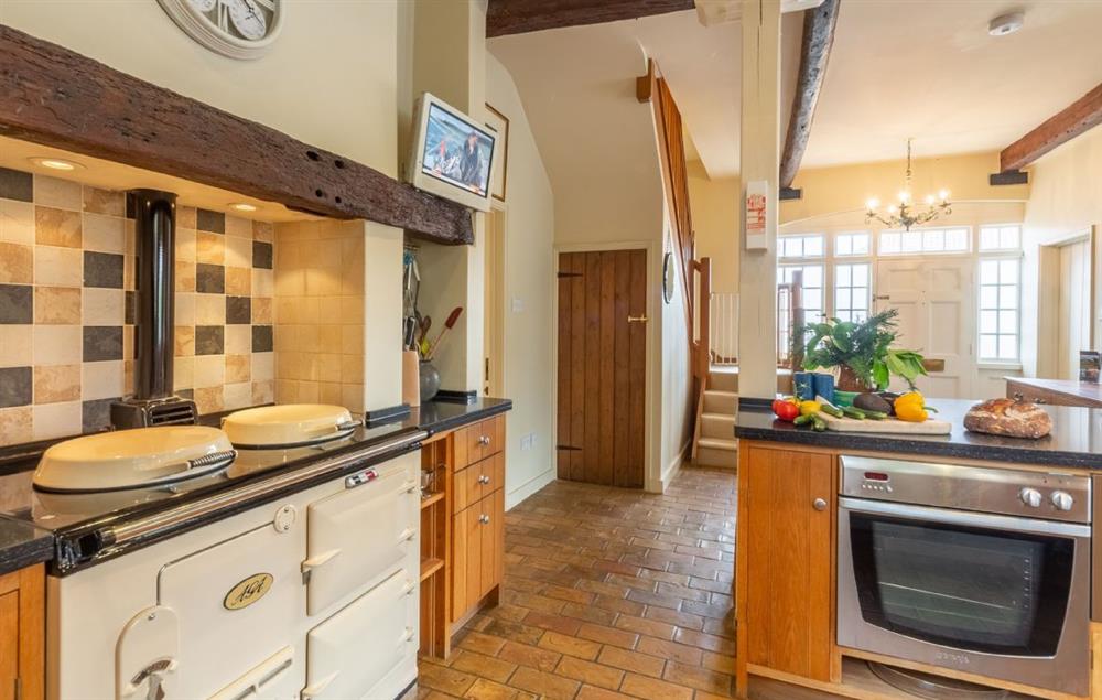 The kitchen is fitted with an Aga and electric oven at Estcourt House, Burnham Market