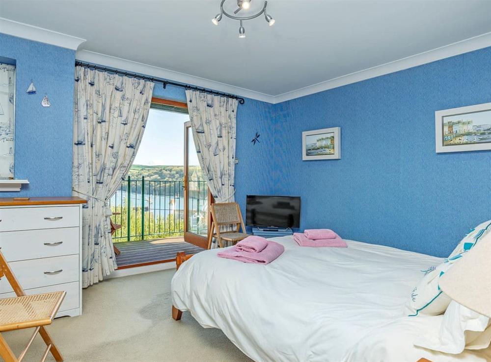 Delightful double bedroom with French doors leading to balcony (photo 2) at Estuary Heights in Fowey, Cornwall