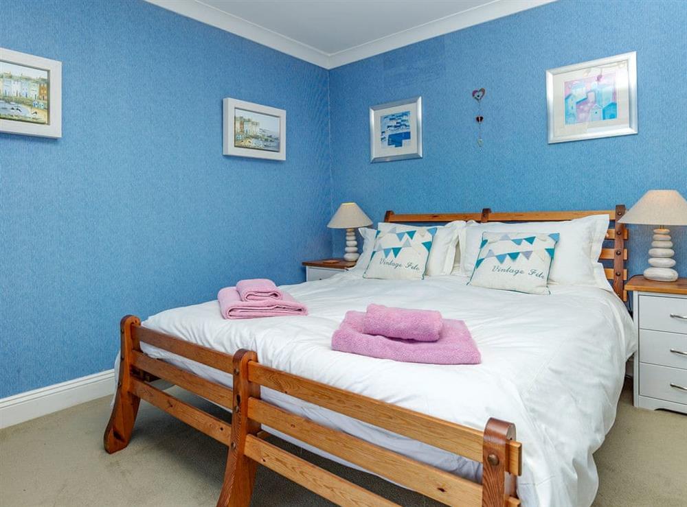 Delightful double bedroom with French doors leading to balcony at Estuary Heights in Fowey, Cornwall