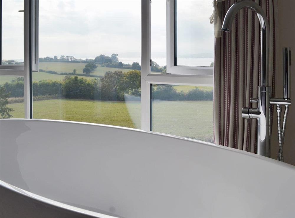 Bathtub in the double bedroom with a marvellous view at Estuary View in Exmouth, Devon