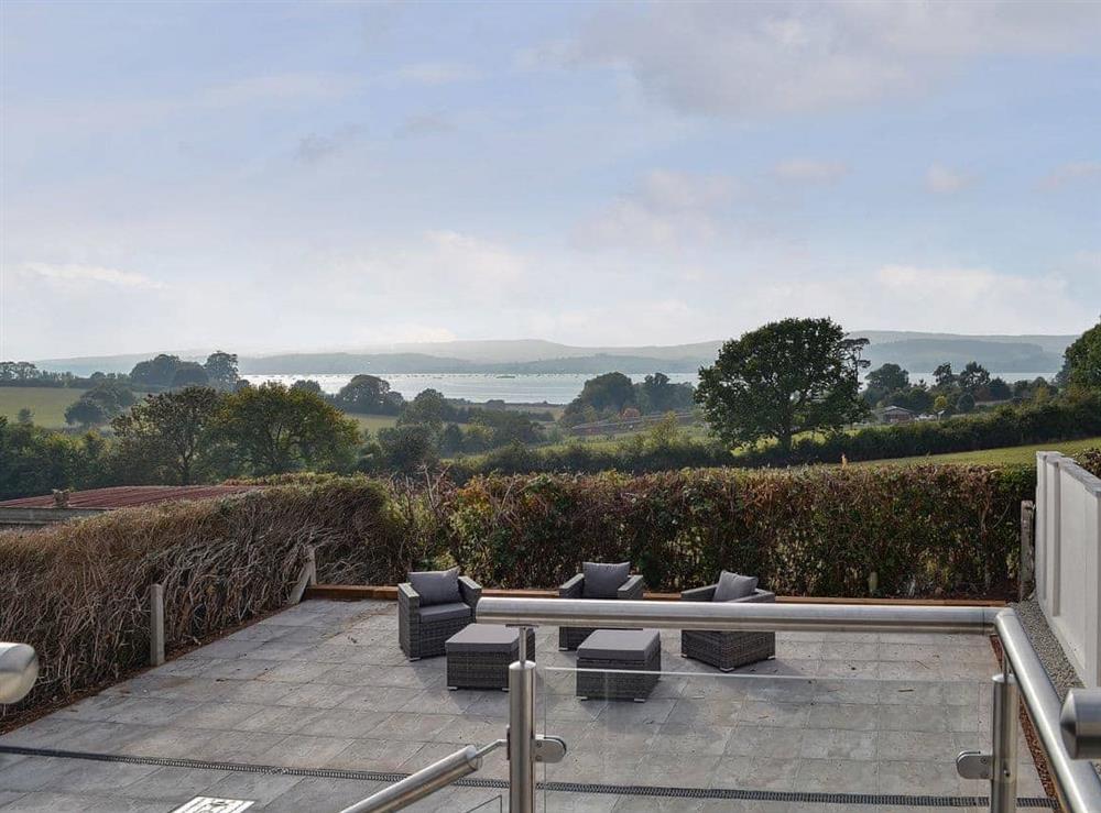 Wonderful paved terraced garden overlooking the River Exe at Estuary View in Exmouth, Devon