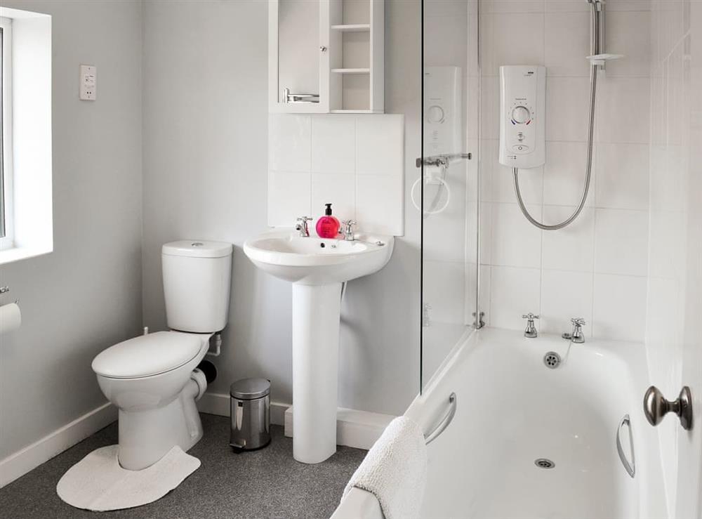 Bathroom with shower over bath, and toilet at Eventide in Broom, near Biggleswade, Bedfordshire
