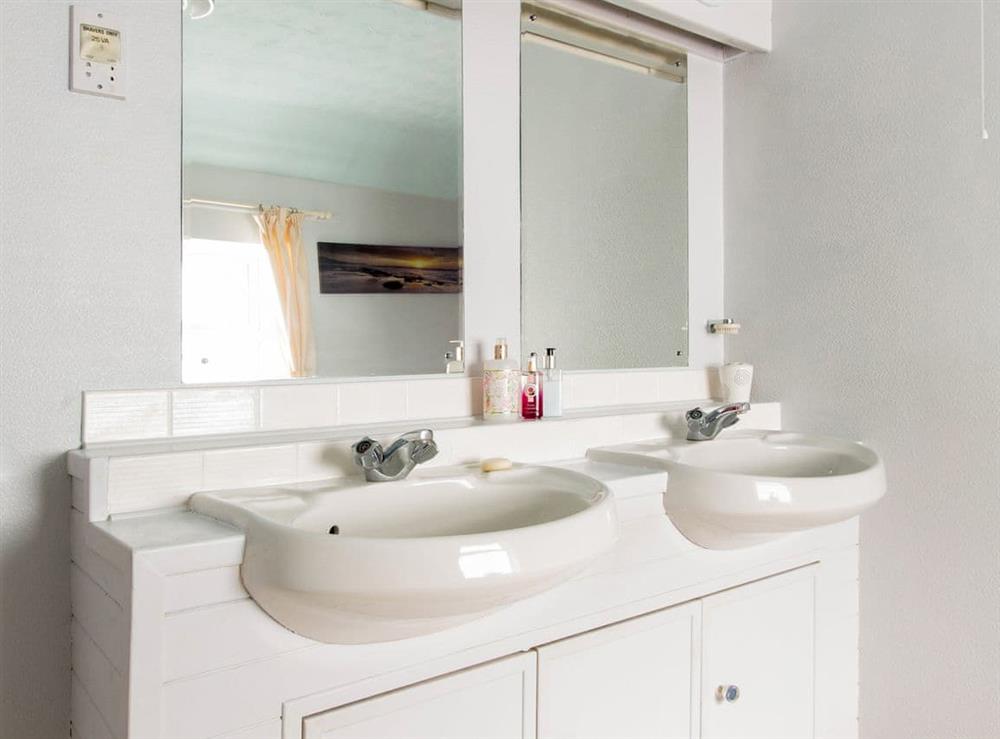 Bathroom boasting twin washbasins at Eventide in Neyland, near Pembroke, Dyfed