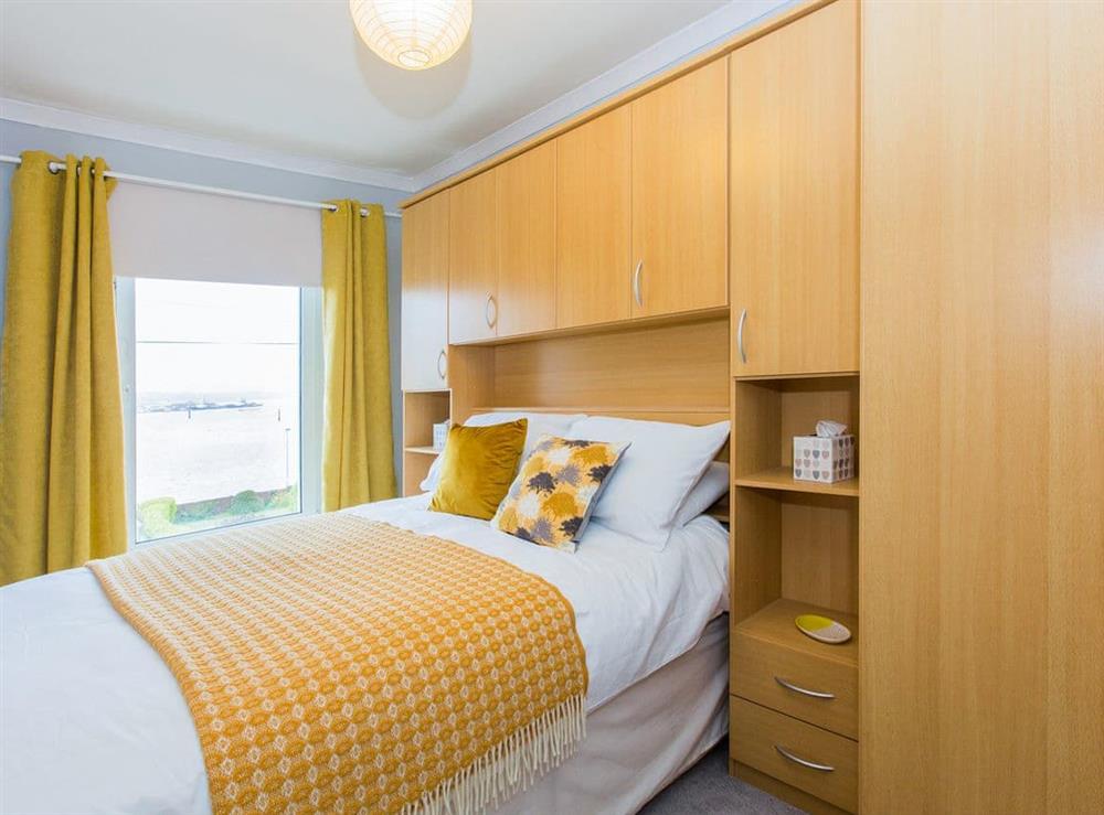 Double bedroom with fitted storage solutions at Eventide in Neyland, near Pembroke, Dyfed