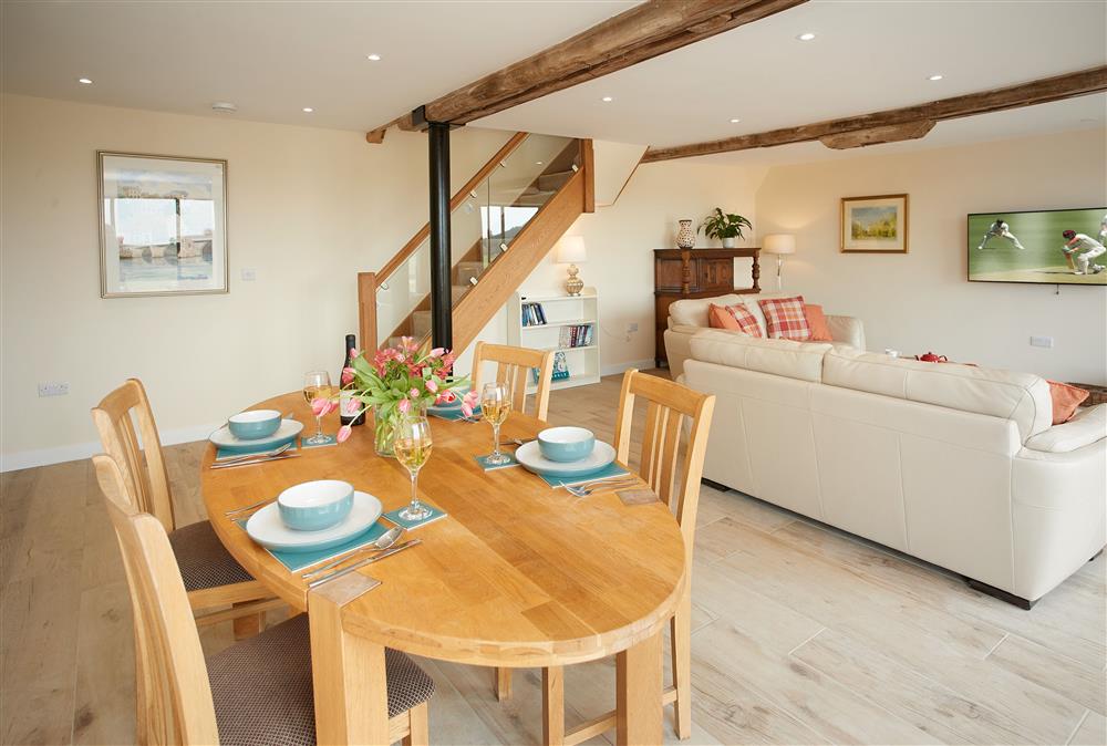Evenwood Granary, Shropshire: Dining area with dining table and seating for four guests at Evenwood Granary, Acton Burnell, Shrewsbury