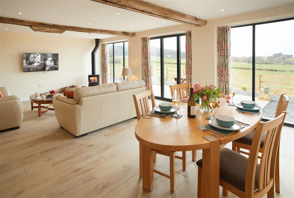 Evenwood Granary, Shropshire: Open-plan sitting and dining areas with bi-fold doors onto the front garden 