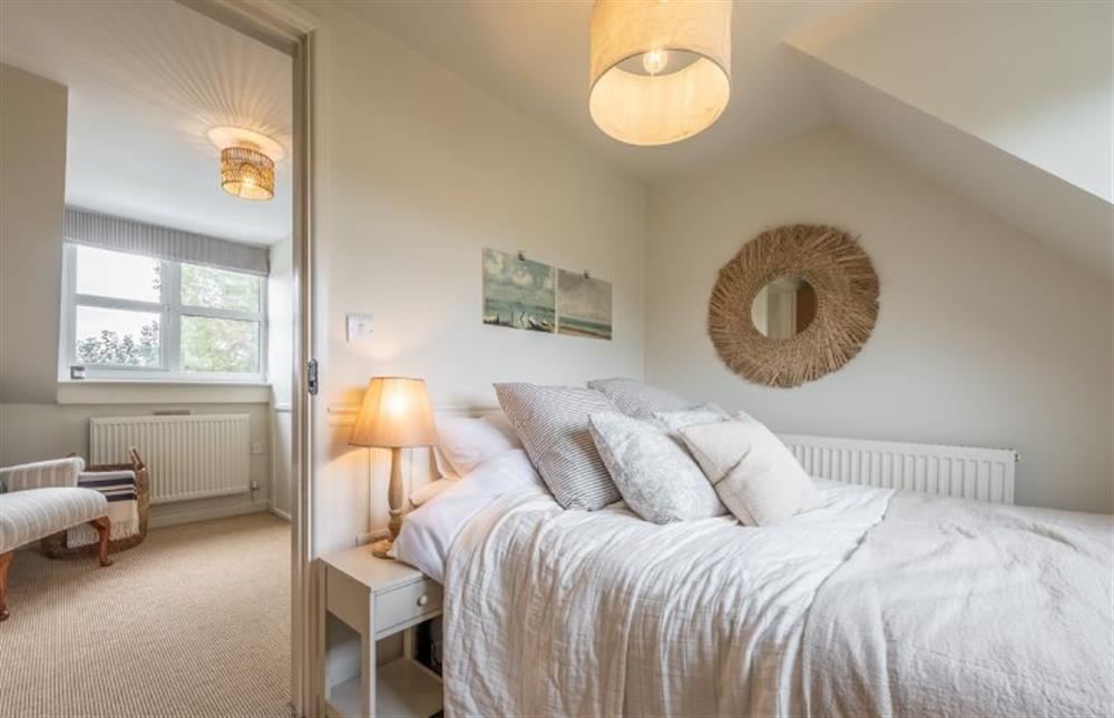 First floor: Bedroom four with double bed at Evergreen, Thornage near Holt