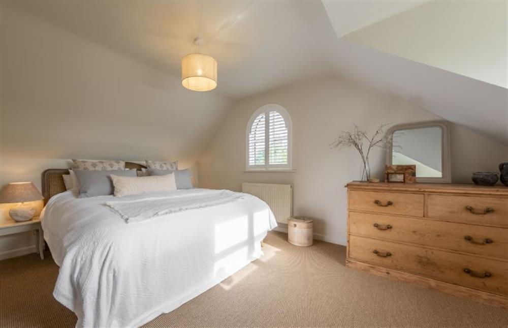 First floor: Bedroom two with super-king size bed at Evergreen, Thornage near Holt