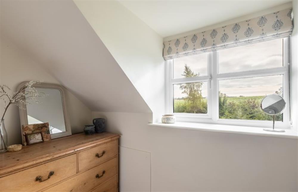 First floor: Countryside views from bedroom two at Evergreen, Thornage near Holt