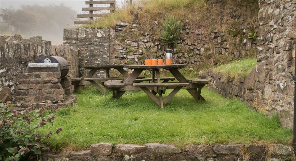 The outdoor seating area at Exmoor Bunkhouse in Lynmouth, Devon