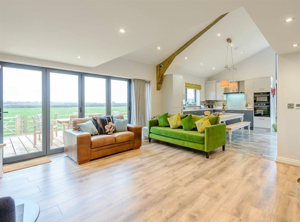 Beautifully decorated open plan living space (photo 3) at Fairchilds Barn, 