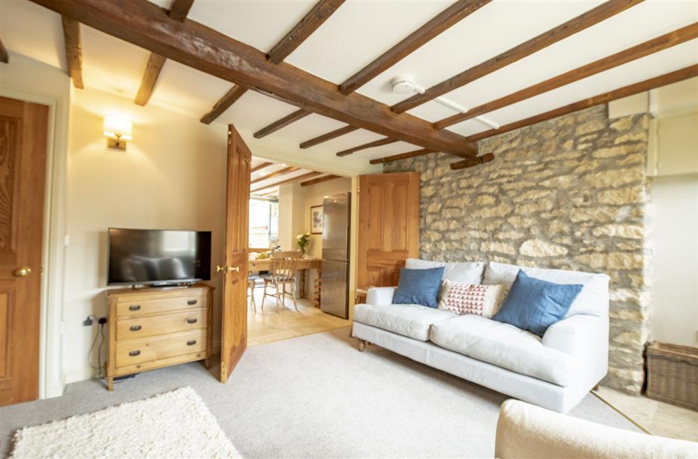 Sitting room with Smart television and an open-fire at Fairview, Ampleforth, North Yorkshire