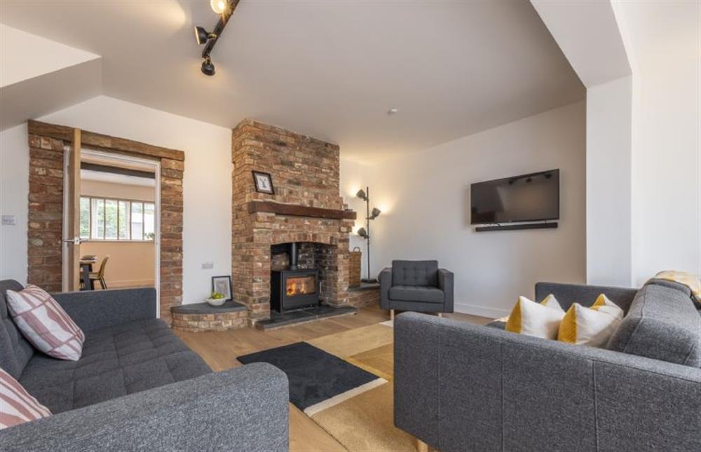 Ample seating around the wood-burning stove and Smart television at Fairway, Old Hunstanton