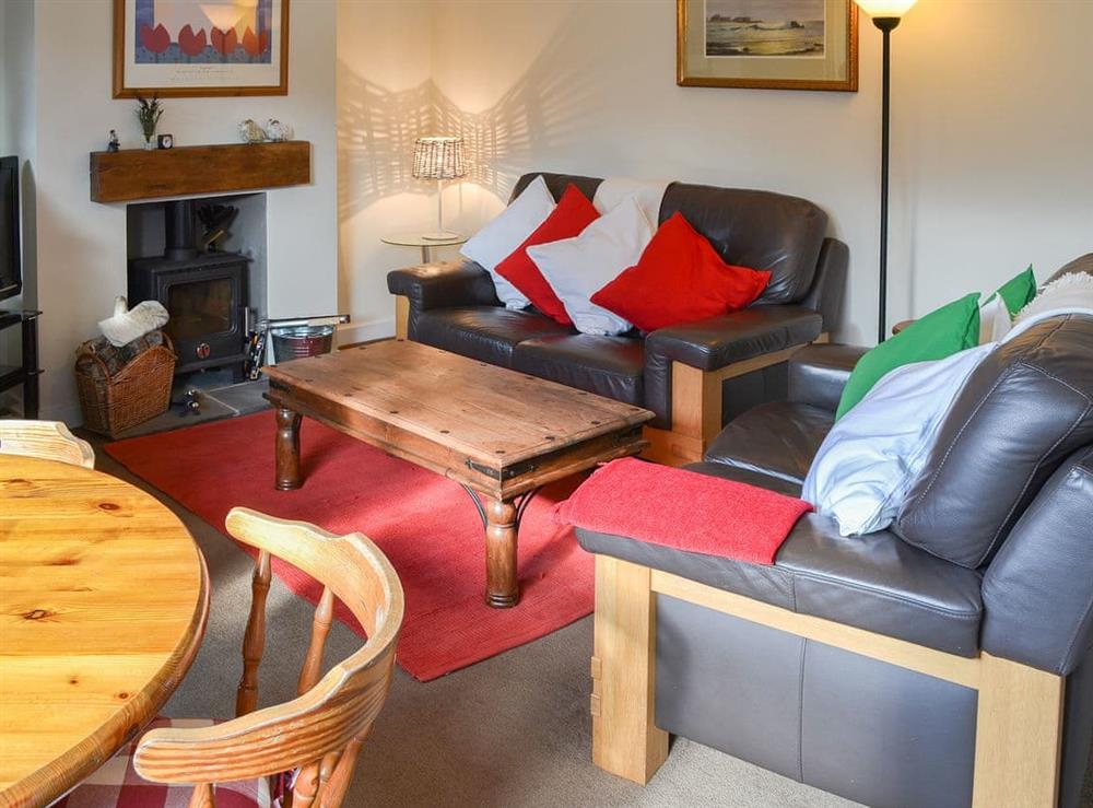 Delightful living area with modest dining area at Fairways in Beadnell, near Seahouses, Northumberland