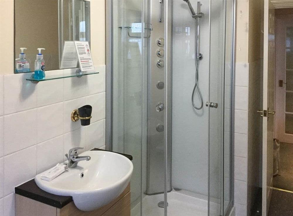Bathroom with standalone shower cubicle at Fairwind in Peacehaven, East Sussex
