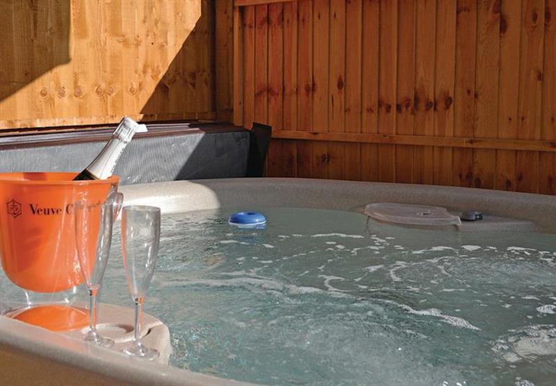 Outdoor hot tub in the Avocet Lodge VIP at Fairwood Lakes Holiday Park in Dilton Marsh, Nr Frome