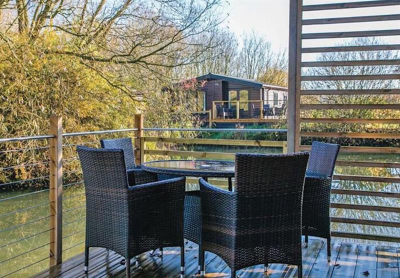 Seating on the decked area in the Eider Lodge at Fairwood Lakes Holiday Park in Dilton Marsh, Nr Frome