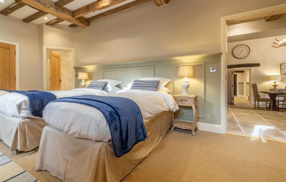 Bedroom configured as a twin with 3’ single beds and en-suite bathroom at Fallow Folly, Little Massingham