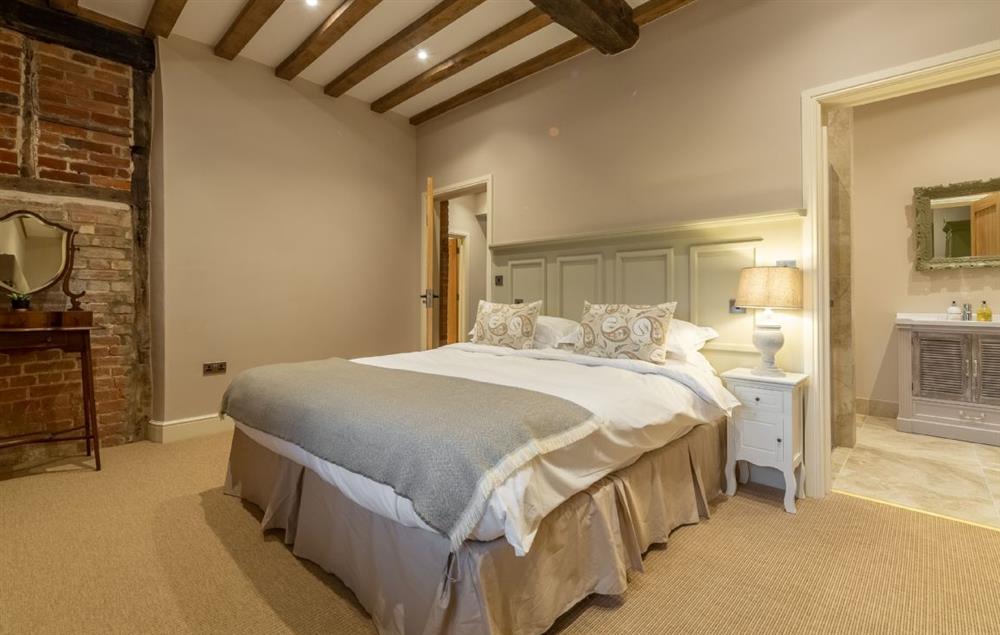 Bedroom with 5’ king size bed and en-suite with walk-in shower at Fallow Folly, Little Massingham