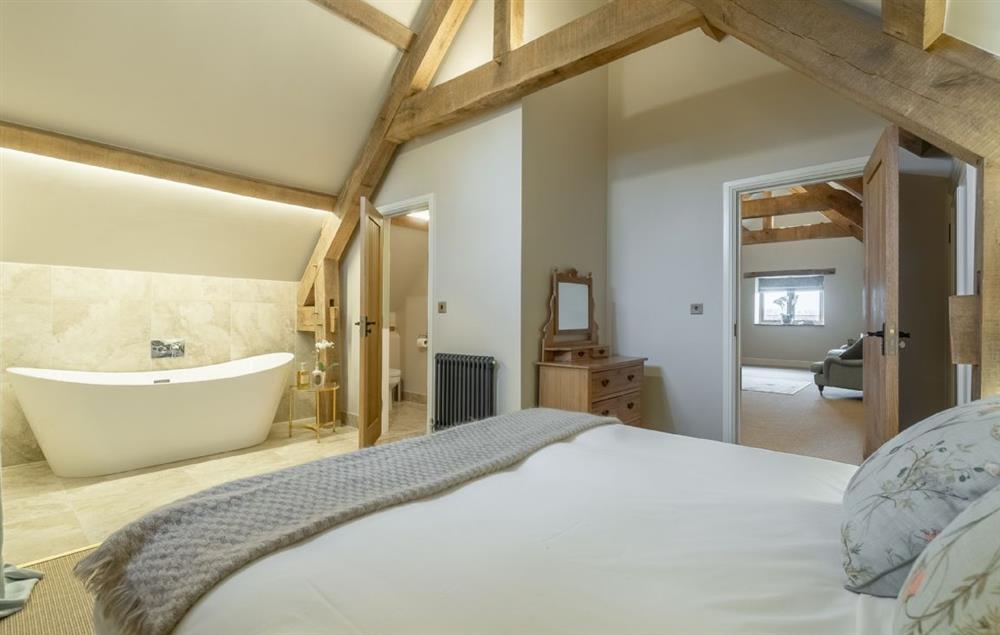 Bedroom with 6’ super king-size bed and en-suite at Fallow Folly, Little Massingham