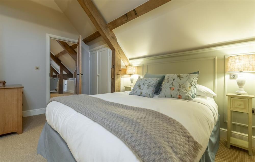 Bedroom with 6’ super king-size bed, views and en-suite shower room at Fallow Folly, Little Massingham