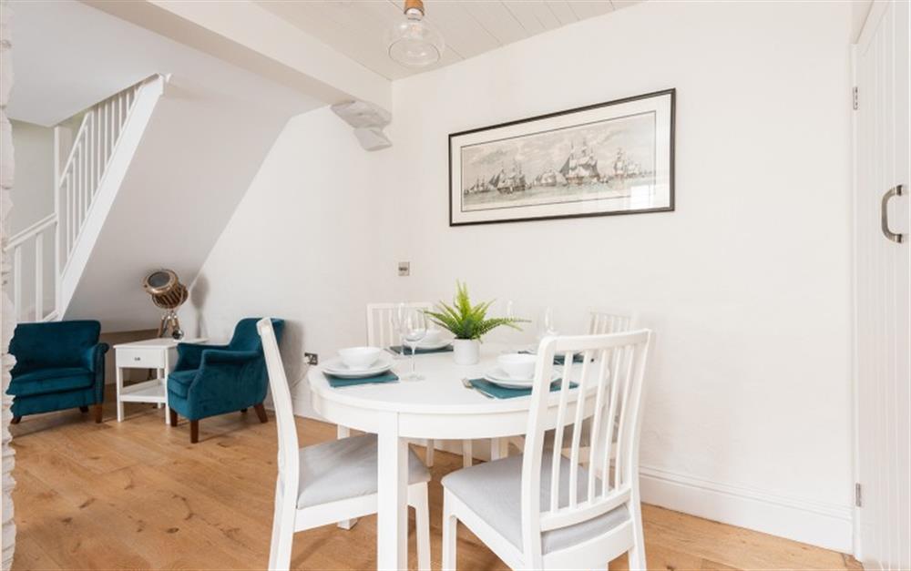 Dining area with table and chairs for 4 at Farriers Cottage, Chipton Barton in Dittisham