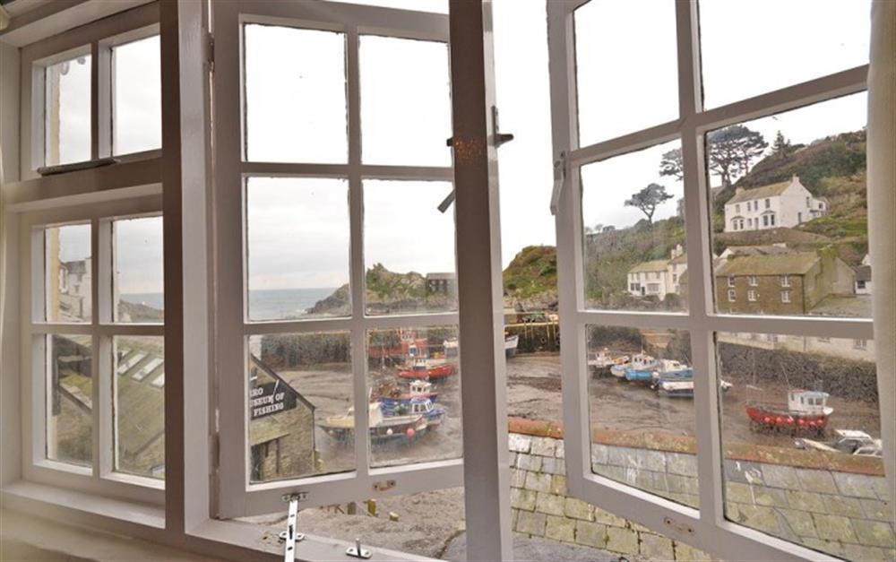 The views (at low tide) enjoyed from the living room at Farthing Cottage in Polperro