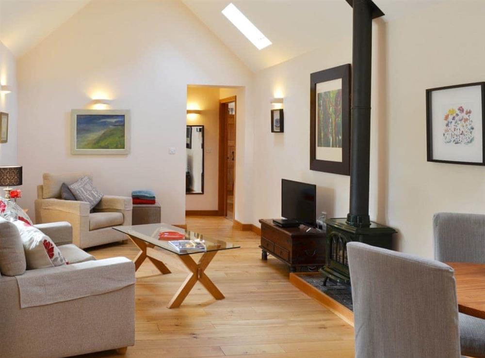 Luxurious Living room/dining room with cosy woodburner at The Stables, 