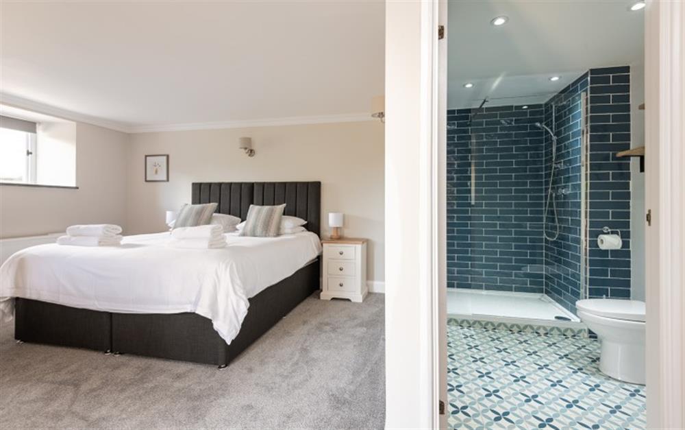 The first ground floor twin/superking bedroom, with cot and en suite shower room. at Farthingfield in South Pool