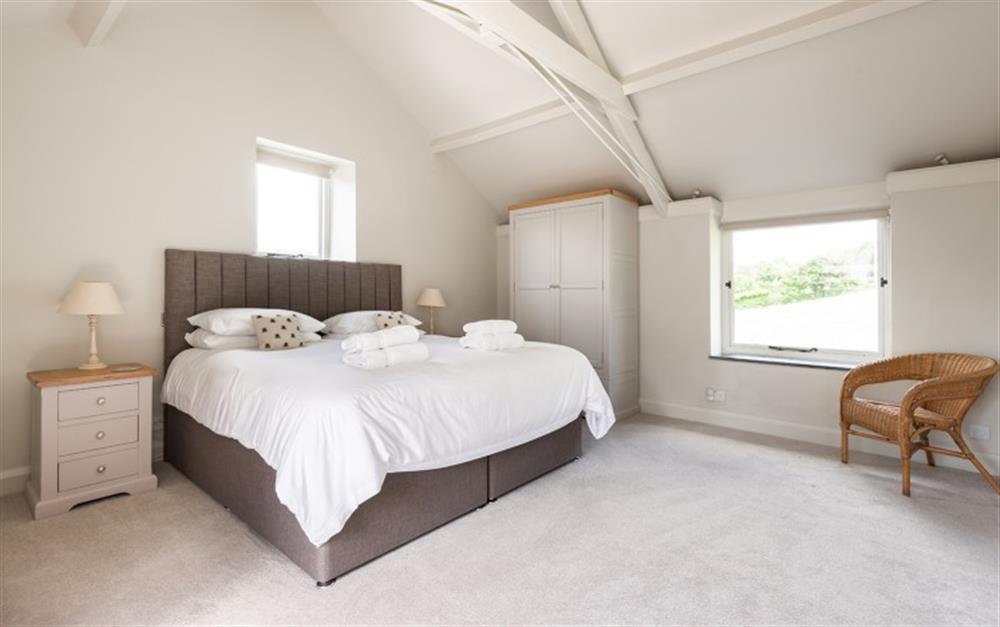 The spacious master bedroom with views over the paddock to the rear and out over South Pool and the estuary at the front. at Farthingfield in South Pool